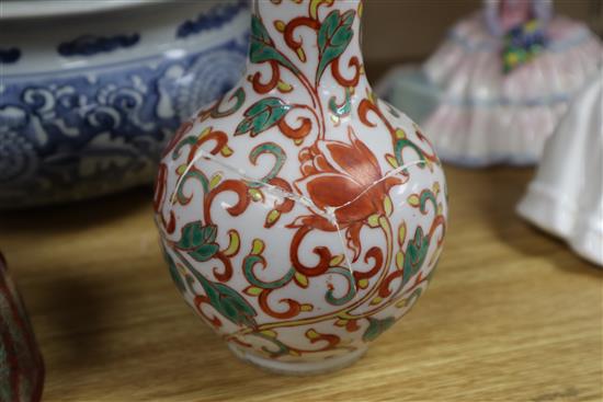 A Chinese blue and white large tripod censer, a peach bloom brush washer and a famille verte vase